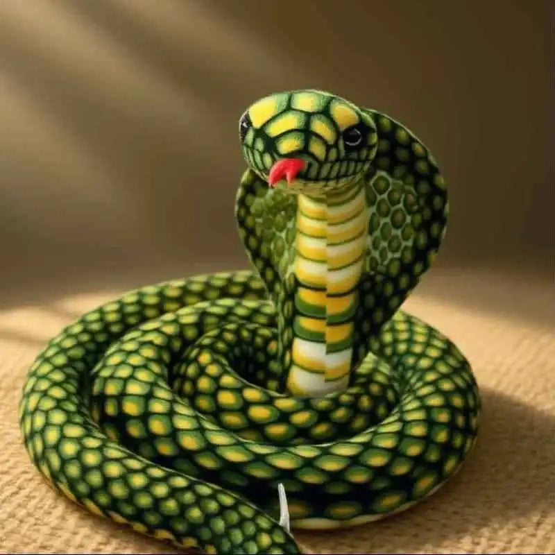 A plush green and yellow cobra with a red tongue, detailed scales, and black eyes.