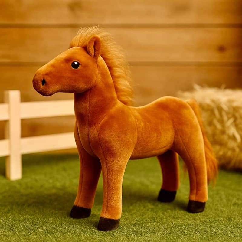 Brown plush toy horse with a tan mane and tail, and black hooves.