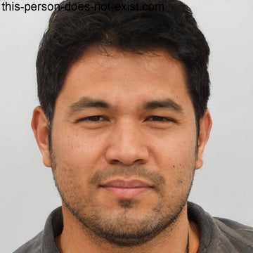 A man with dark hair and a beard.