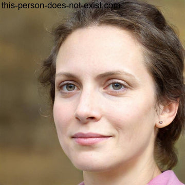 A woman’s headshot with light brown hair and fair skin.